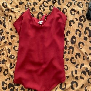 Red flowy tank with an open back and chain straps